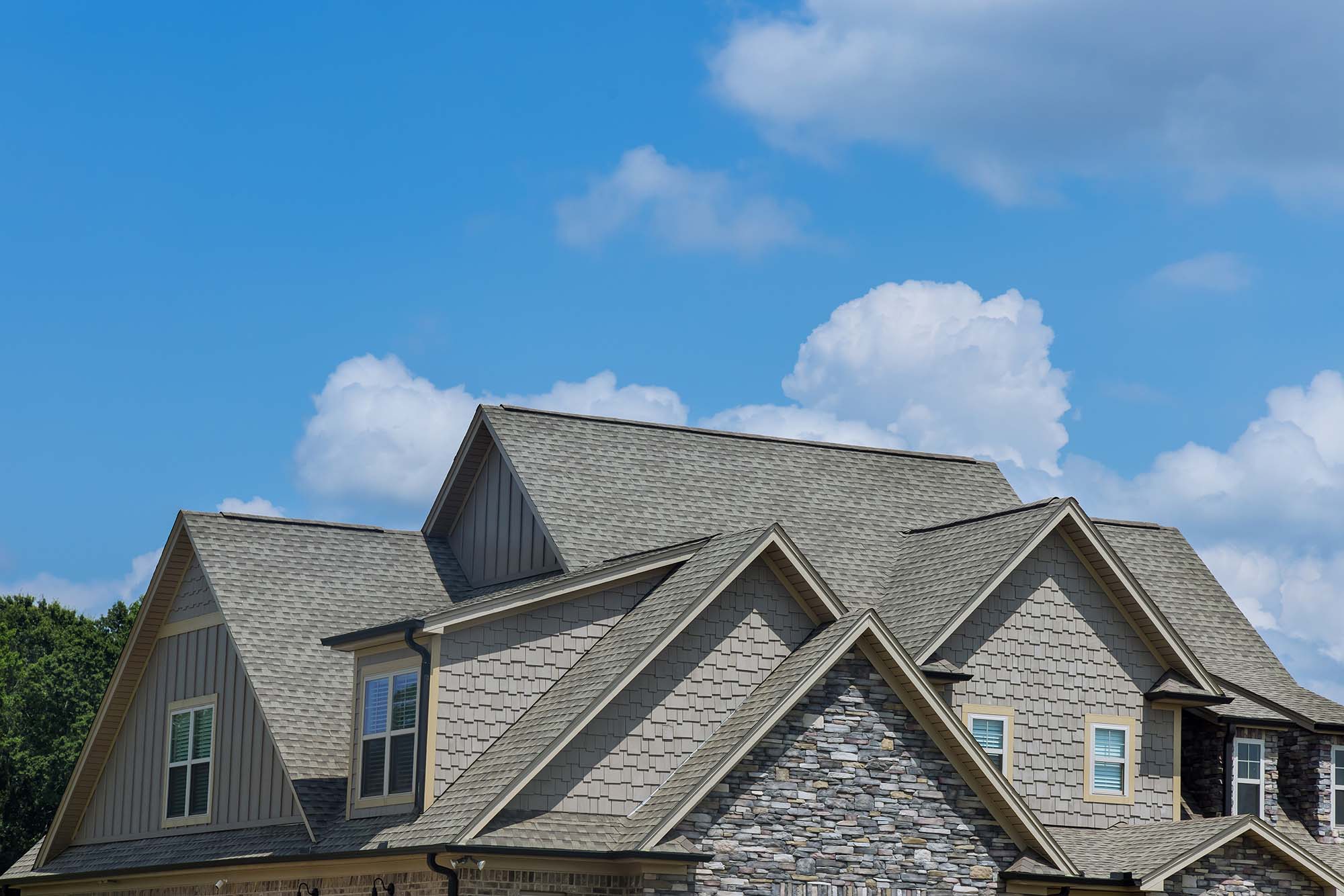 A home with a new asphalt shingle roof