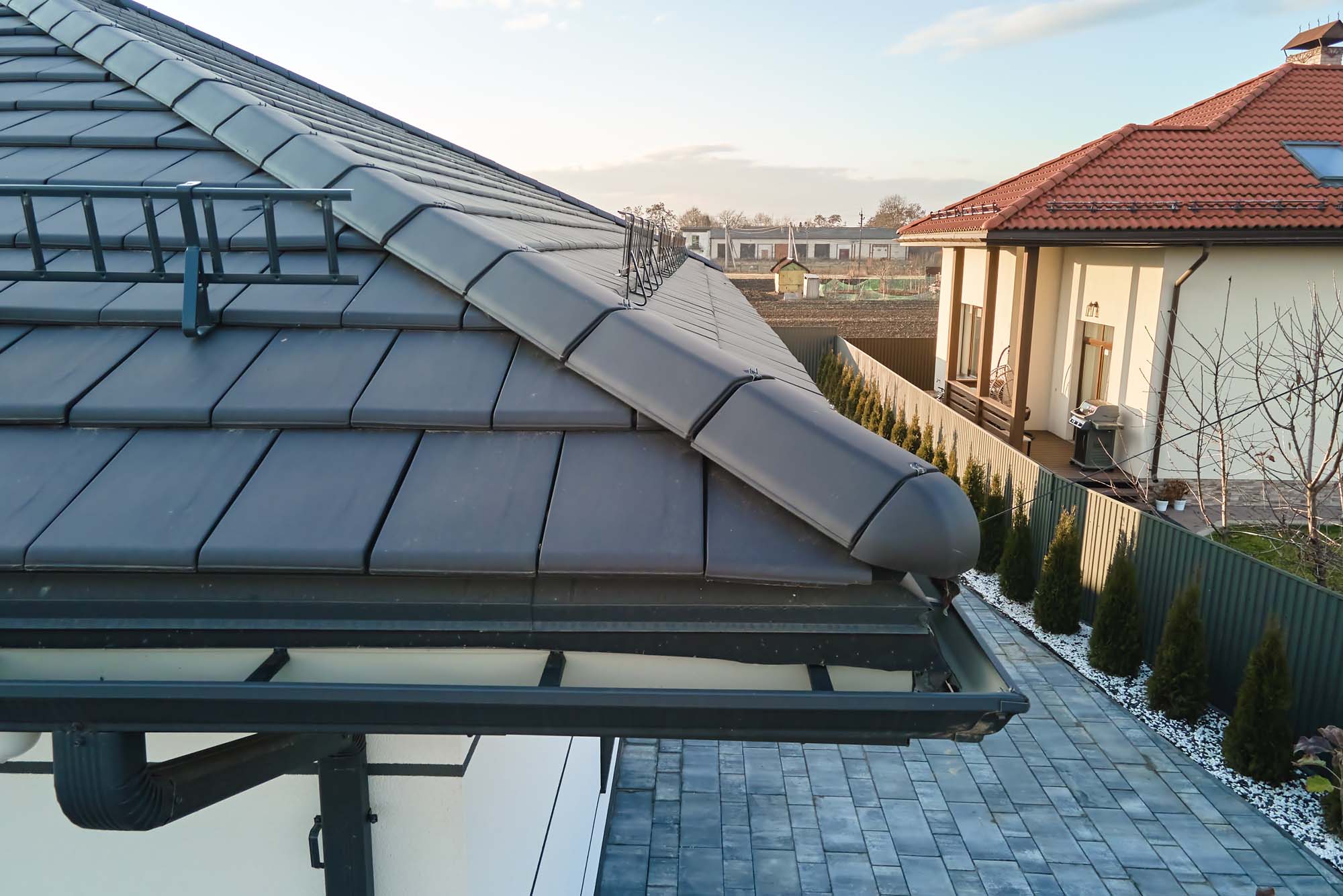 Aerial view of a home with gutters for draining water from the roof